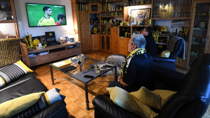 Borussia Dortmund fans watch their club play Bayern Munich